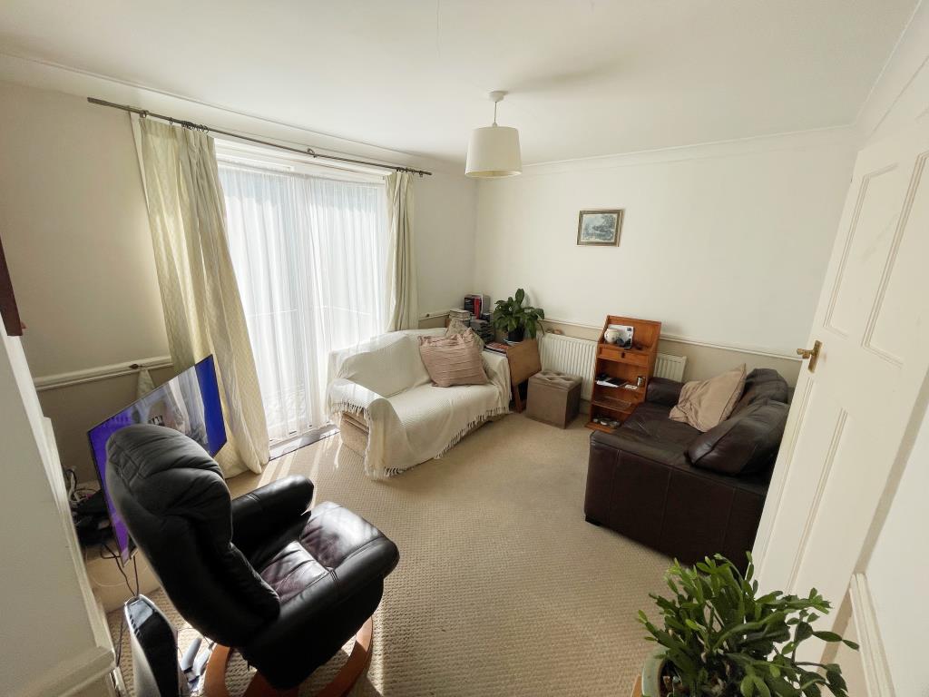 Lot: 38 - TWO-BEDROOM DETACHED BUNGALOW FOR IMPROVEMENT - Living room with French doors